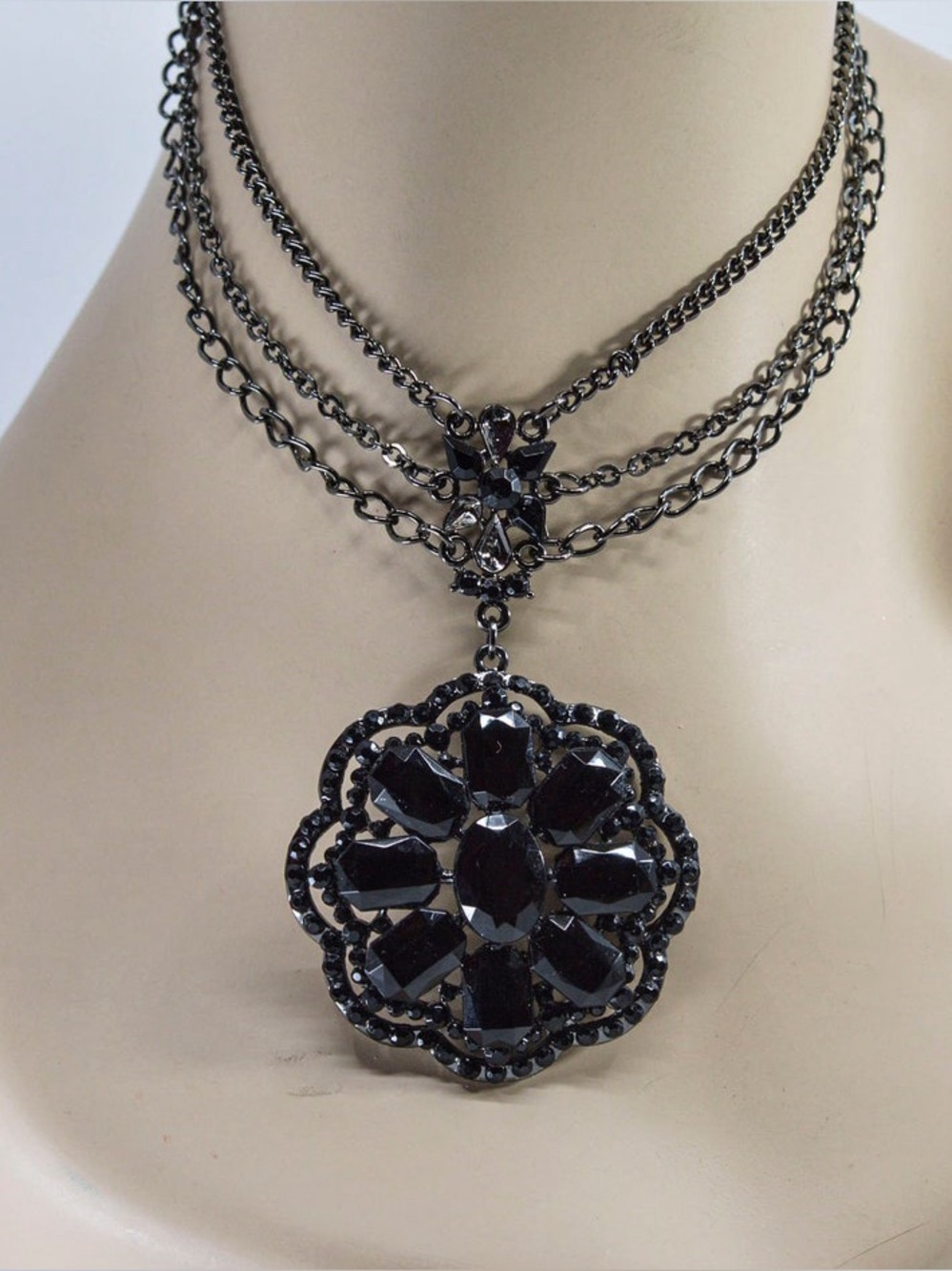 Anna Sui necklace w triple strand chain & an ornate pendant w rhinestones